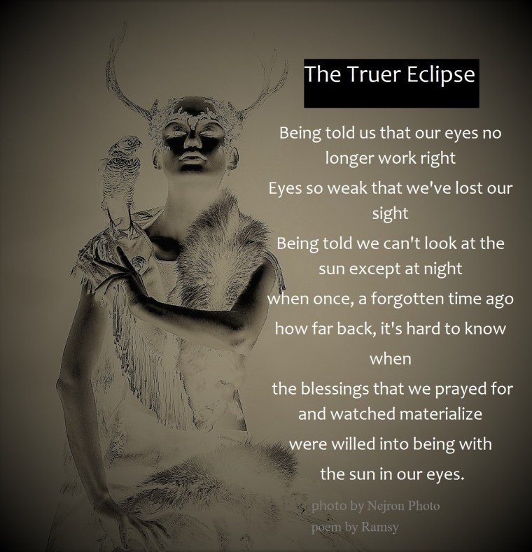 Woman shaman in ritual garment with hawk