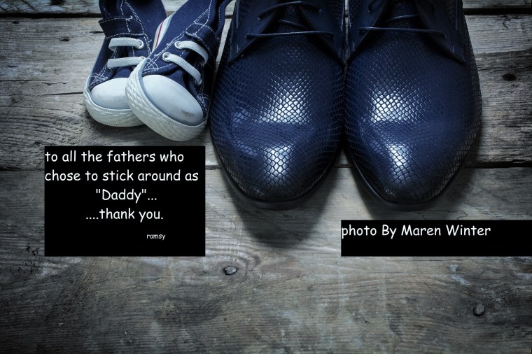 father's shoes and kids sneakers side by side on rustic wood, father's day