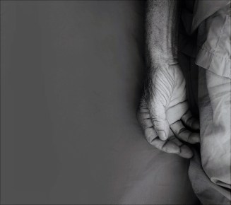 old man hand sleeping in a hospital