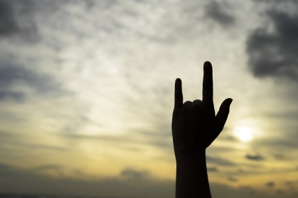 Silhouette Body hand language, I LOVE YOU, Hand signed at Sunset