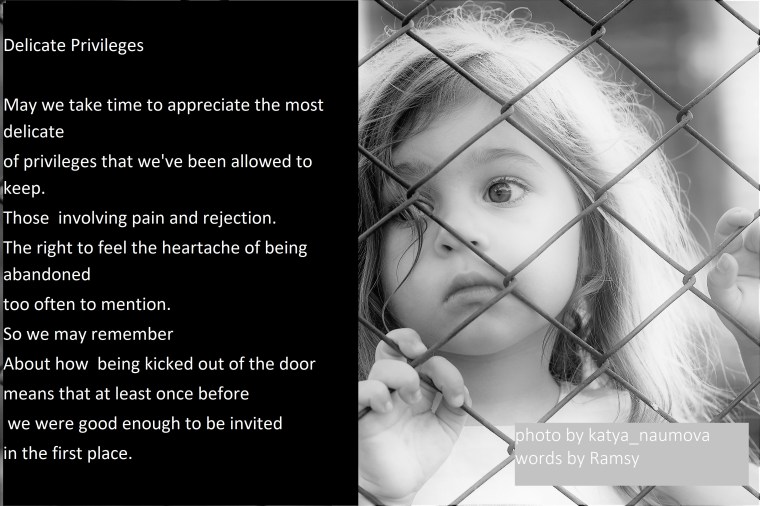 Toned portrait of Sad little girl looks through wire fence