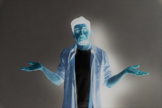 Portrait of a confused young casual shrugging shoulders